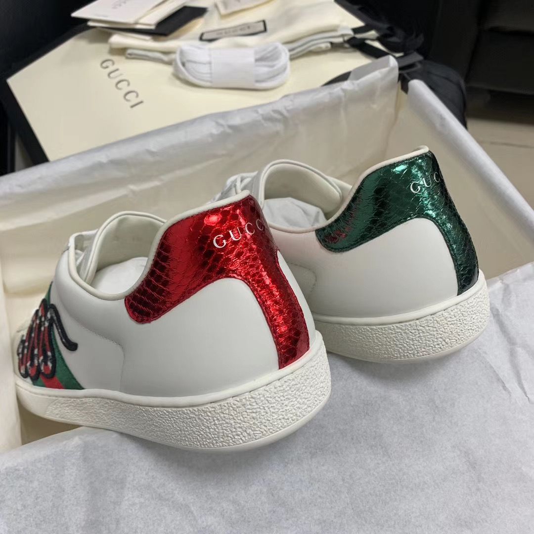 Gu*** Snake Sneakers