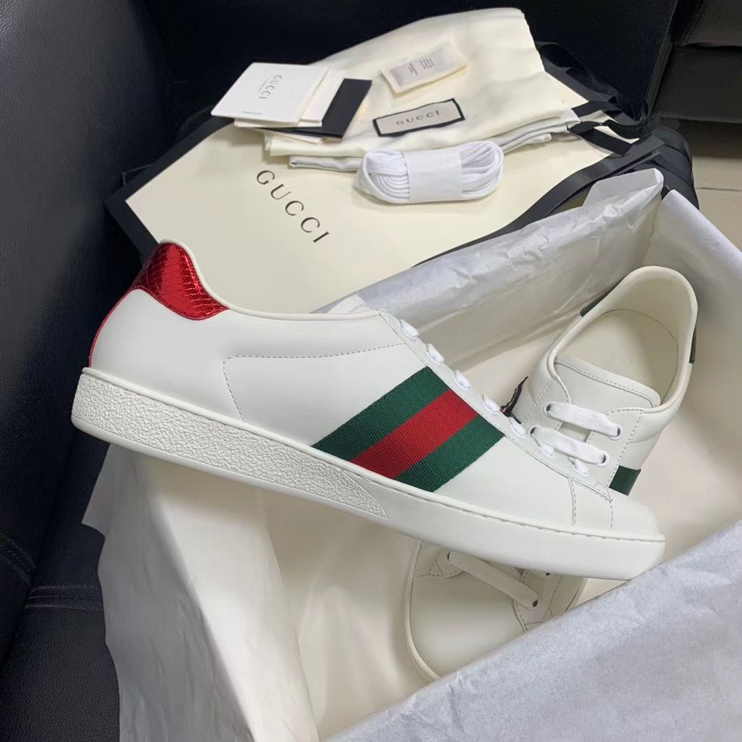 Gu*** Snake Sneakers